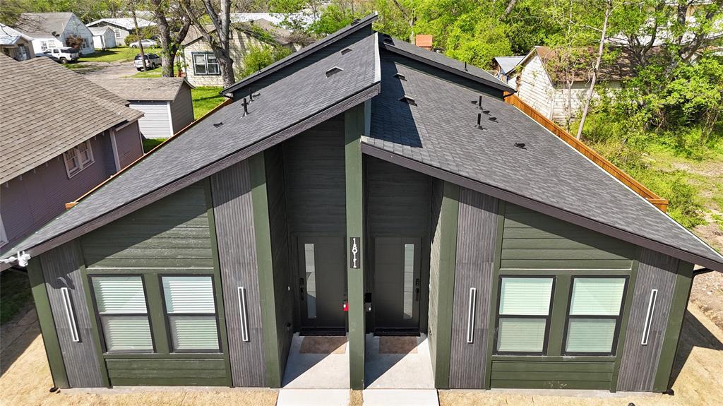 1811 Washington Street Commerce, TX 75428 - Photo 2 of 36 a view of balcony with wooden floor and fence