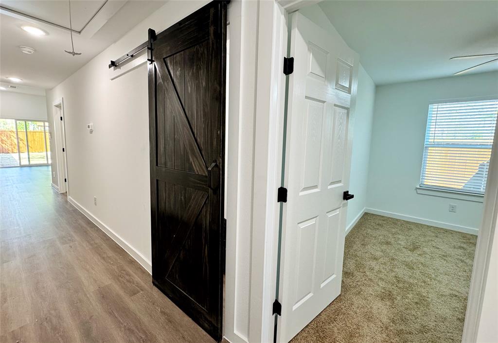 1811 Washington Street Commerce, TX 75428 - Photo 24 of 36 a view of hallway with wooden floor