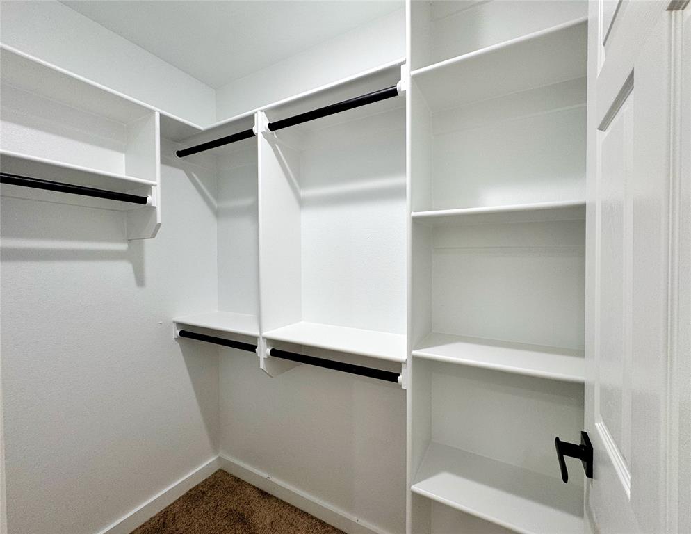 1811 Washington Street Commerce, TX 75428 - Photo 26 of 36 a view of an empty walk in closet