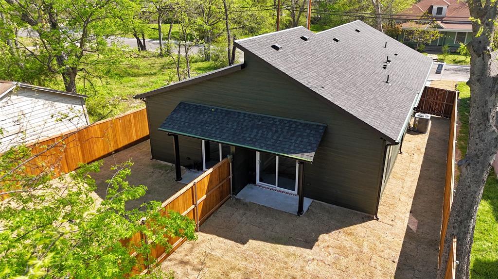 1811 Washington Street Commerce, TX 75428 - Photo 34 of 36 a view of a roof deck with wooden floor and a potted plant