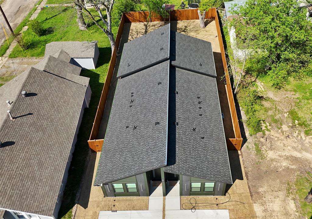 1811 Washington Street Commerce, TX 75428 - Photo 35 of 36 an aerial view of a house with a yard