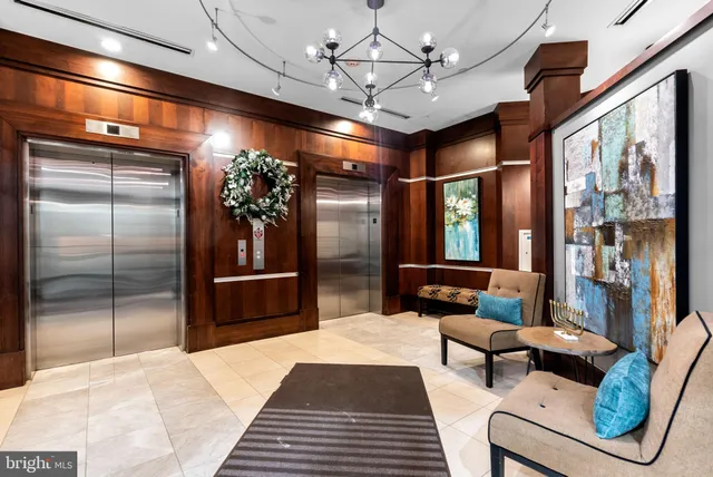 a lobby with furniture and window