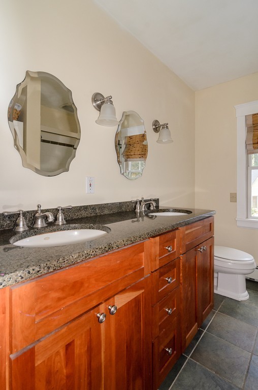 30 Birch Road Natick, MA 01760 - Photo 14 of 21 a bathroom with a sink and mirror