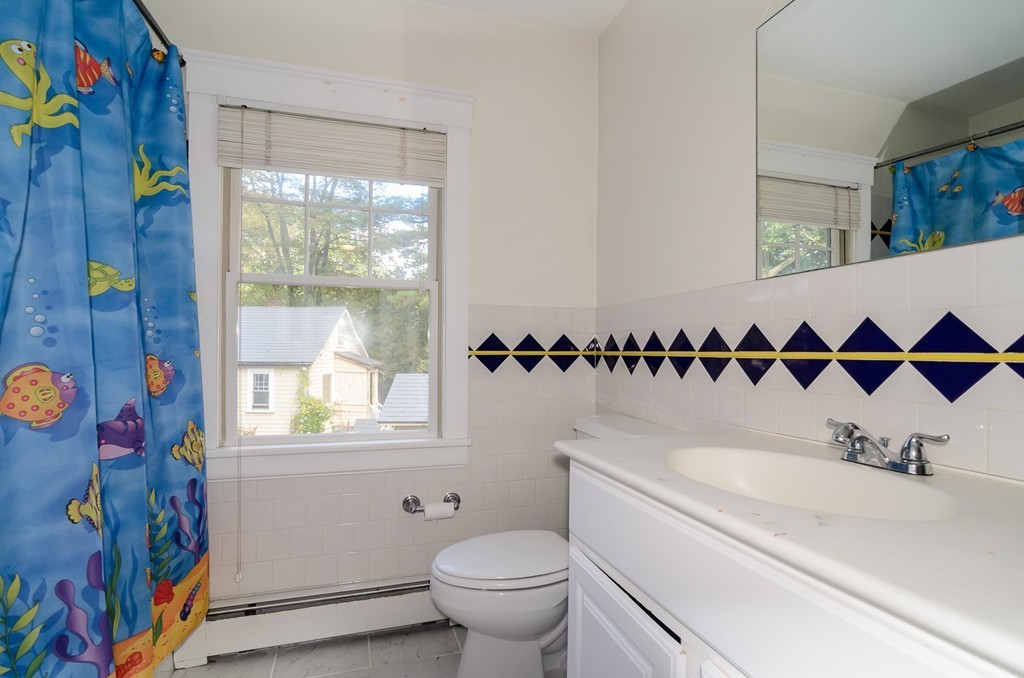 30 Birch Road Natick, MA 01760 - Photo 17 of 21 a bathroom with a sink and a mirror