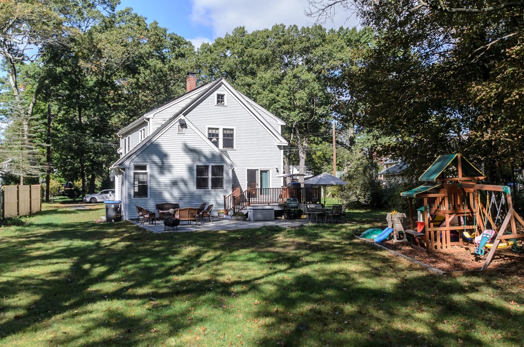 30 Birch Road Natick, MA 01760 - Photo 21 of 21 a view of a house with a yard and sitting area