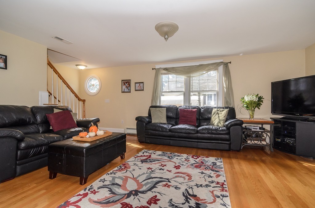 30 Birch Road Natick, MA 01760 - Photo 3 of 21 a living room with furniture and a flat screen tv
