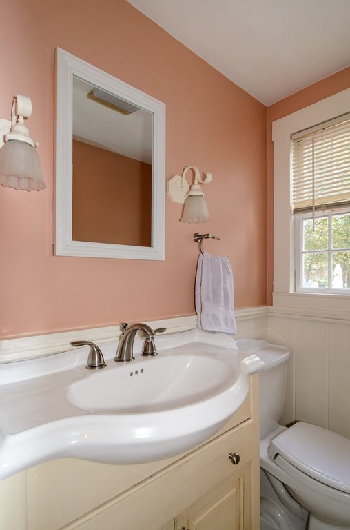30 Birch Road Natick, MA 01760 - Photo 9 of 21 a bathroom with a toilet sink and mirror