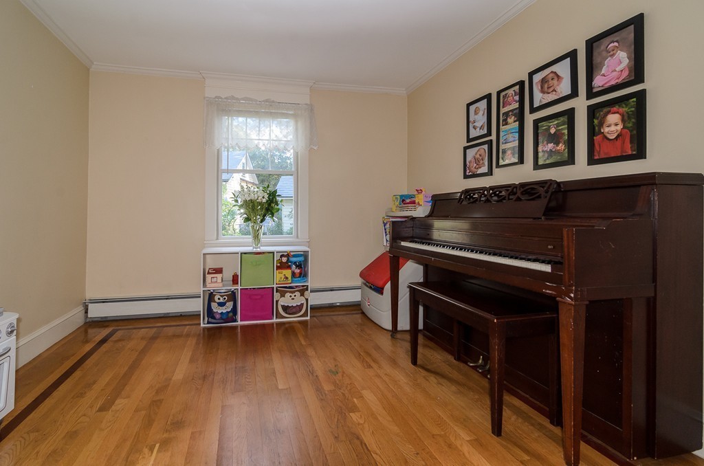 30 Birch Road Natick, MA 01760 - Photo 10 of 21 a living room with furniture and paintings on the wall