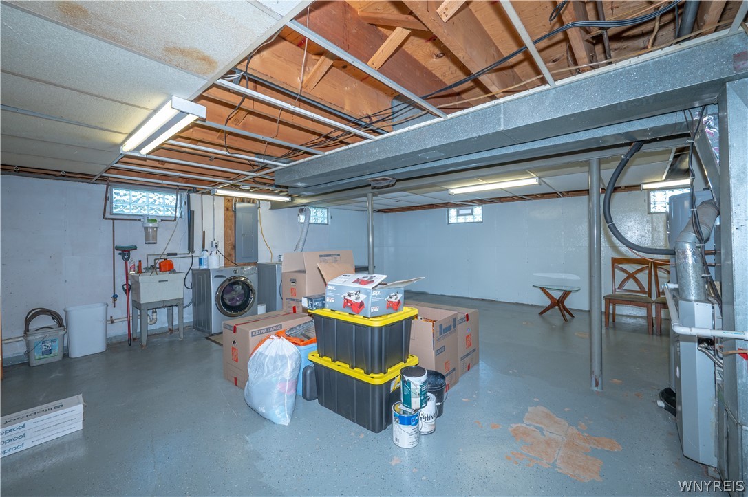 6463 Ward Road Sanborn, NY 14132 - Photo 34 of 49 A spacious basement area offers dedicated laundry hookups and plenty of room for storage.
