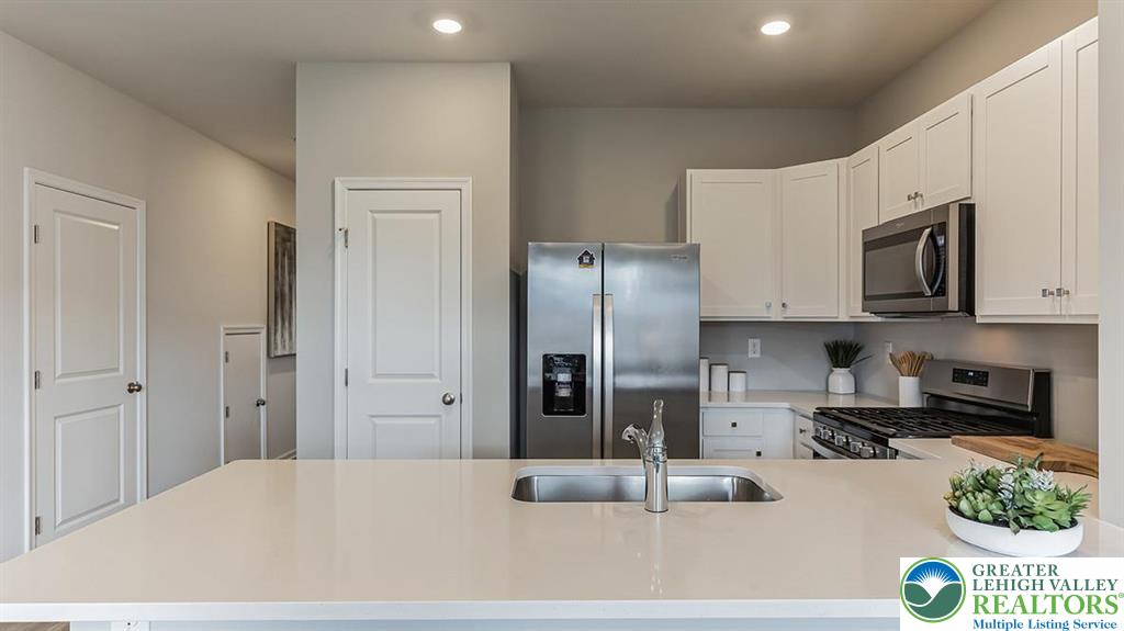 1151 Martin Road Breinigsville, PA 18031 - Photo 12 of 25 a kitchen with stainless steel appliances granite countertop a refrigerator a stove and a sink