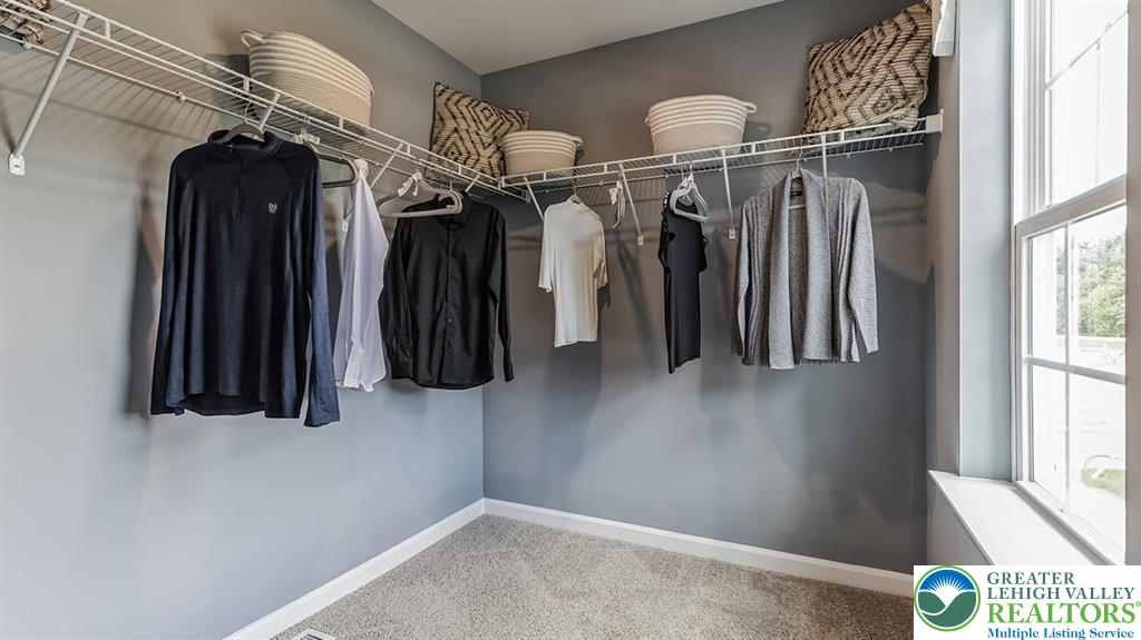 1151 Martin Road Breinigsville, PA 18031 - Photo 17 of 25 a view of walk in closet with clothes and shoes