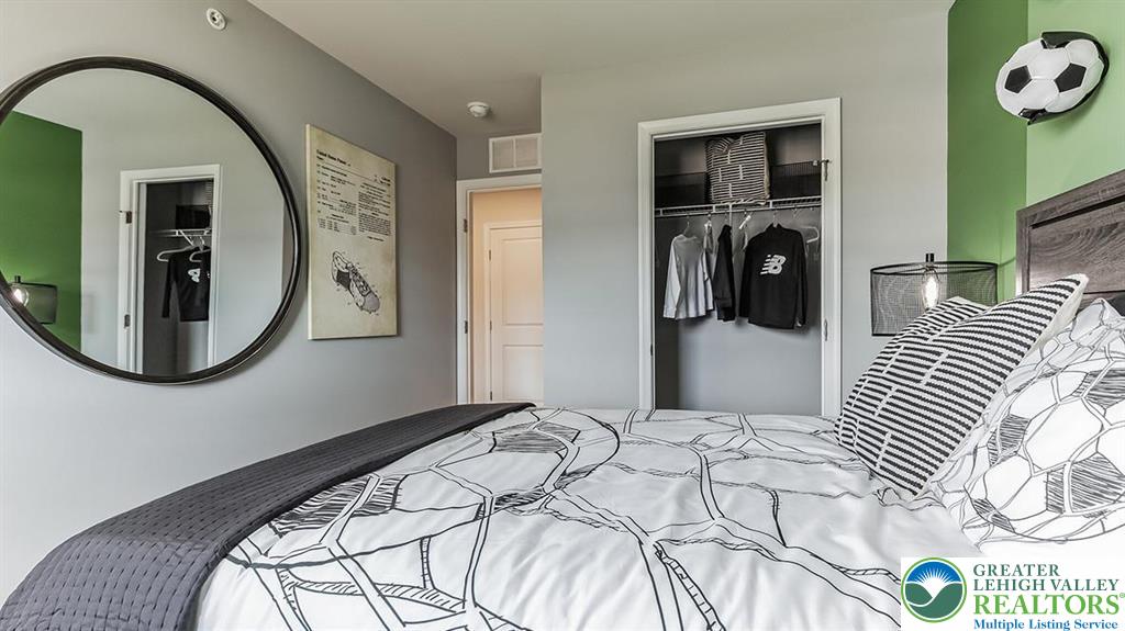 1151 Martin Road Breinigsville, PA 18031 - Photo 21 of 25 a bedroom with a bed and a mirror