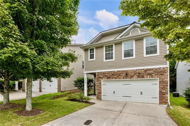 a front view of a house with a yard