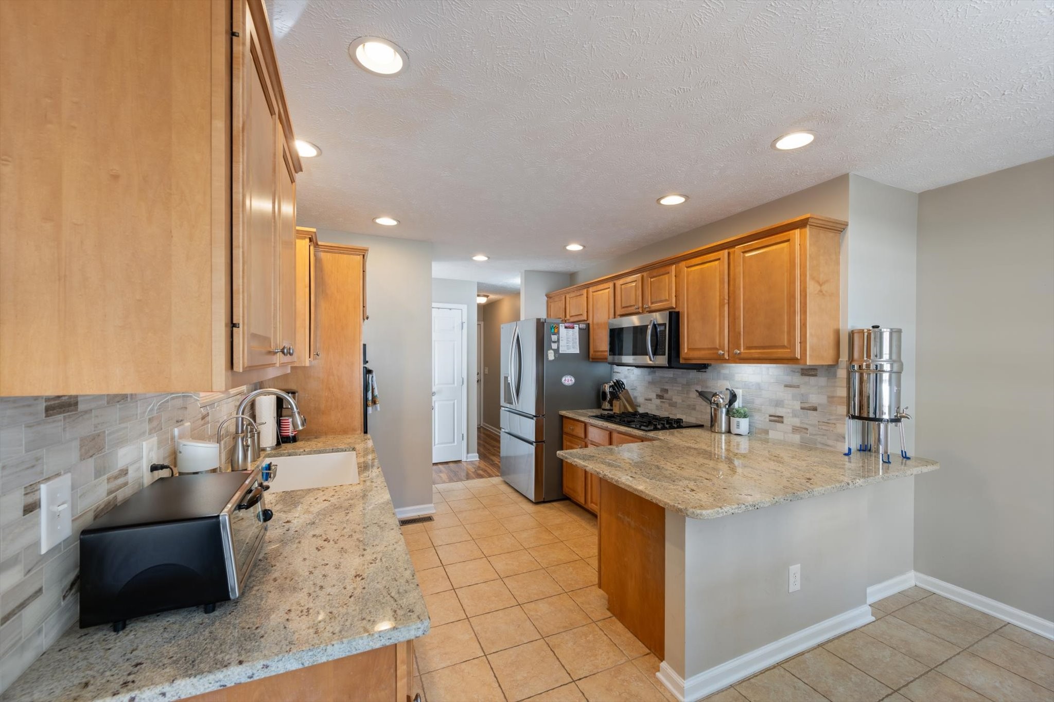 560 Windy Road Mount Juliet, TN 37122 - Photo 11 of 40 a kitchen with a sink microwave and cabinets