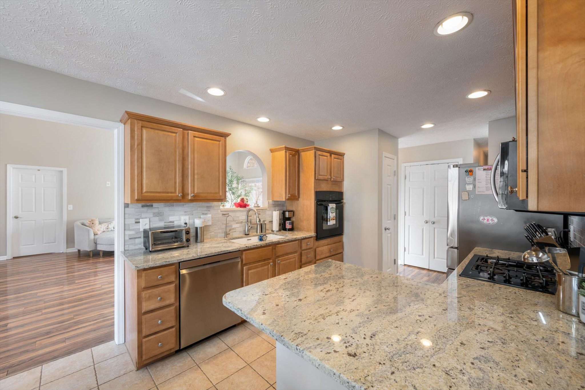 560 Windy Road Mount Juliet, TN 37122 - Photo 12 of 40 a large kitchen with kitchen island a sink stainless steel appliances and cabinets