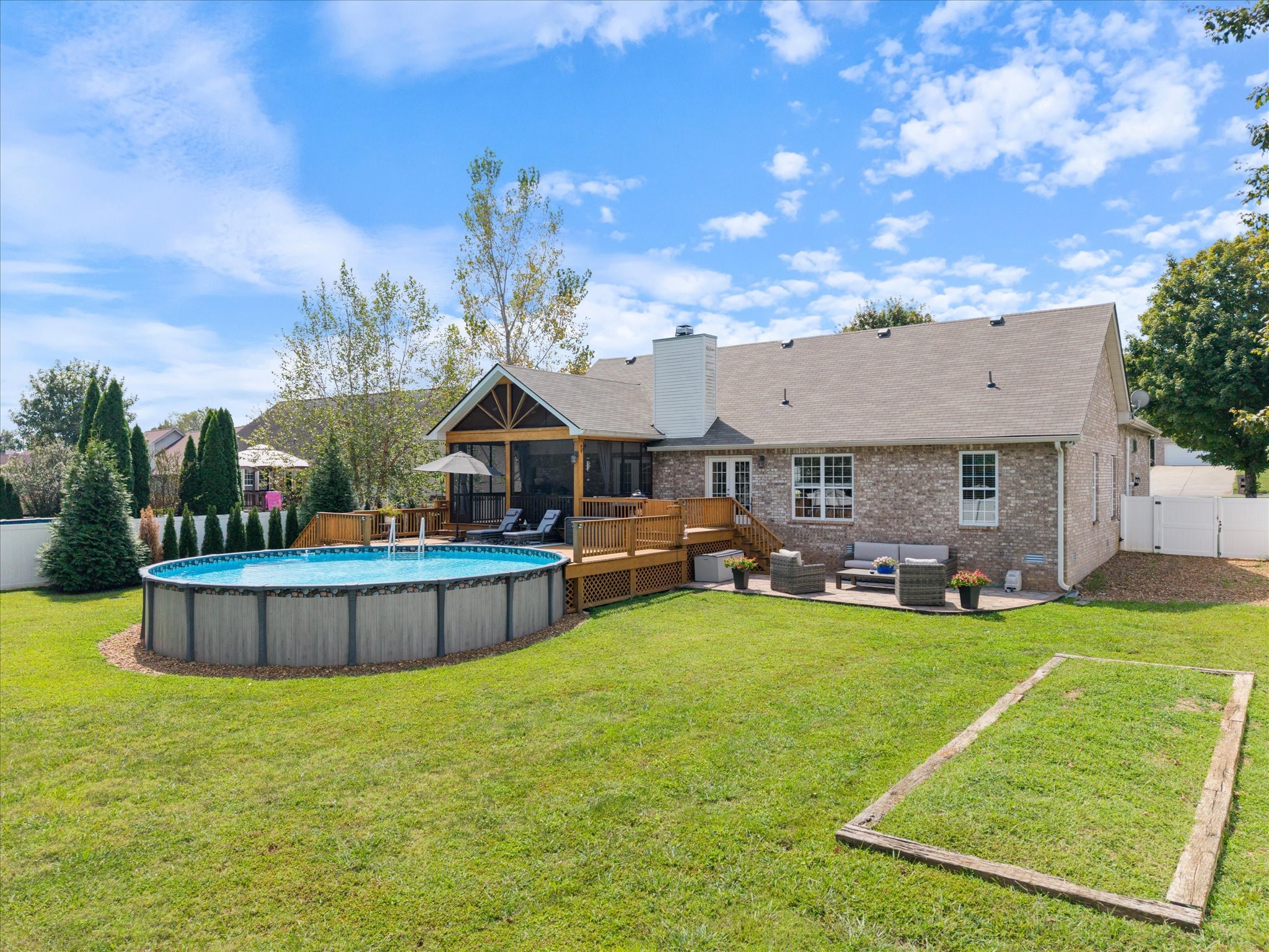 560 Windy Road Mount Juliet, TN 37122 - Photo 29 of 40 a view of a house with swimming pool and a yard