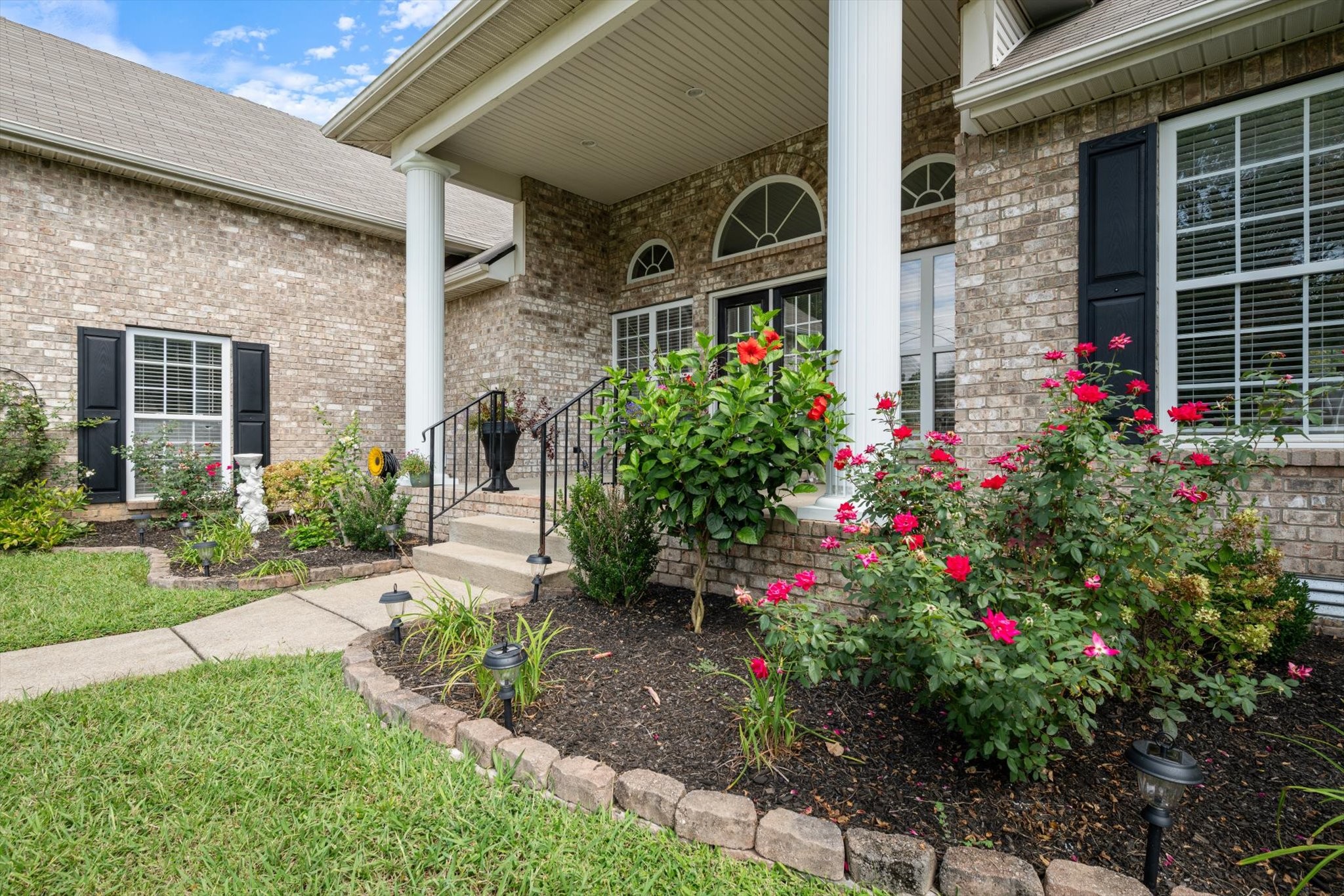 560 Windy Road Mount Juliet, TN 37122 - Photo 4 of 40 a flower garden is sitting in front of house