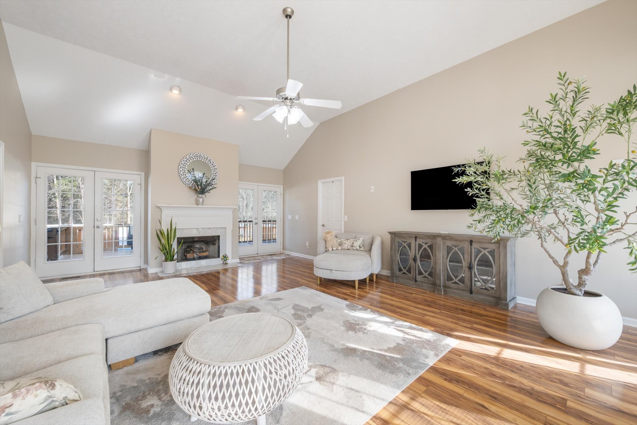 560 Windy Road Mount Juliet, TN 37122 - Photo 6 of 40 a living room with furniture a fireplace and a flat screen tv