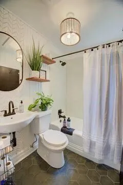 a bathroom with a sink a mirror and a toilet