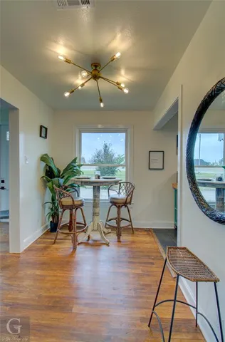 a view of a livingroom with furniture and a potted plant