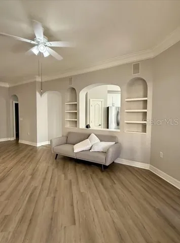 a view of livingroom with furniture wooden floor and window