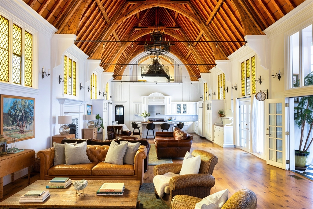 279 Main Street Groton, MA 01450 - Photo 3 of 9 a living room with furniture a fireplace and a large window