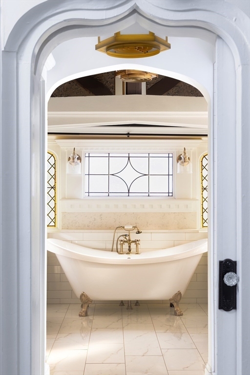 279 Main Street Groton, MA 01450 - Photo 5 of 9 a bathroom with a bathtub