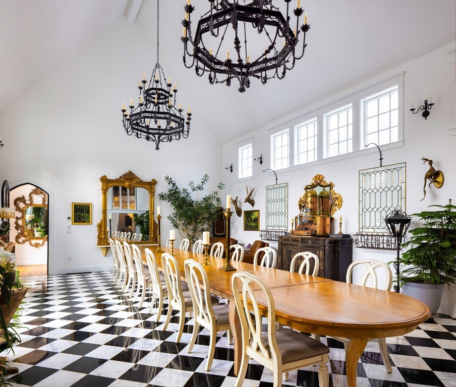 279 Main Street Groton, MA 01450 - Photo 6 of 9 a view of a dining room with furniture and chandelier