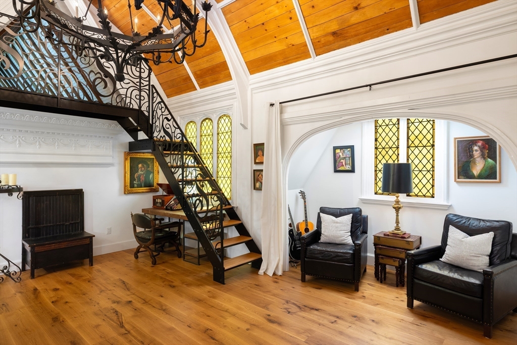 279 Main Street Groton, MA 01450 - Photo 7 of 9 a living room with furniture and a fireplace