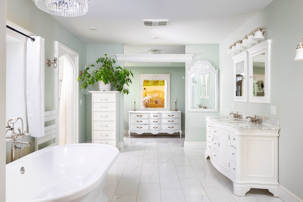 279 Main Street Groton, MA 01450 - Photo 9 of 9 a en suite spacious bathroom with a tub double vanity and window