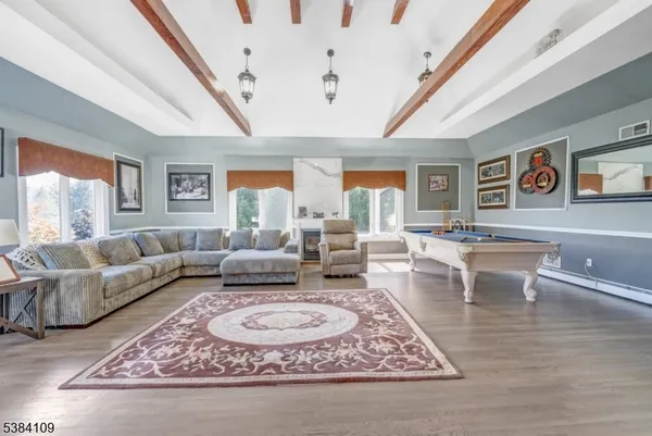 a living room with furniture rug and window