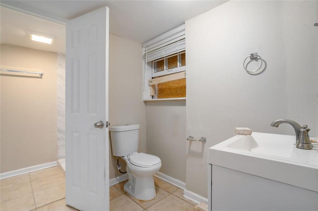 1714 Camperdown Circle Decatur, GA 30035 - Photo 10 of 15 a bathroom with a toilet sink and vanity