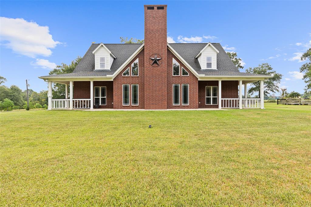 1321 North Fm 1970 Timpson, TX 75975 - Photo 26 of 29 a front view of a house with a garden and trees