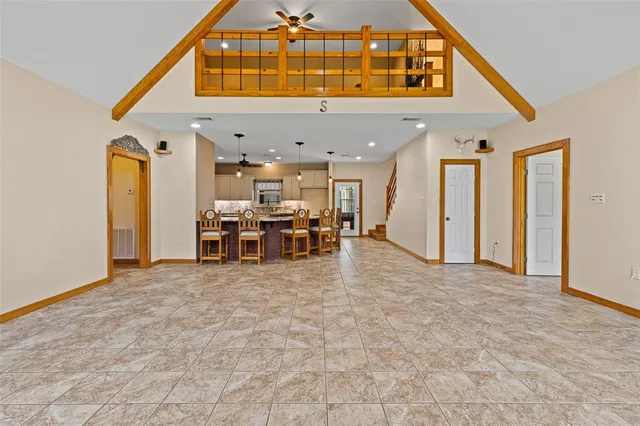 a kitchen with stainless steel appliances granite countertop a sink and a stove