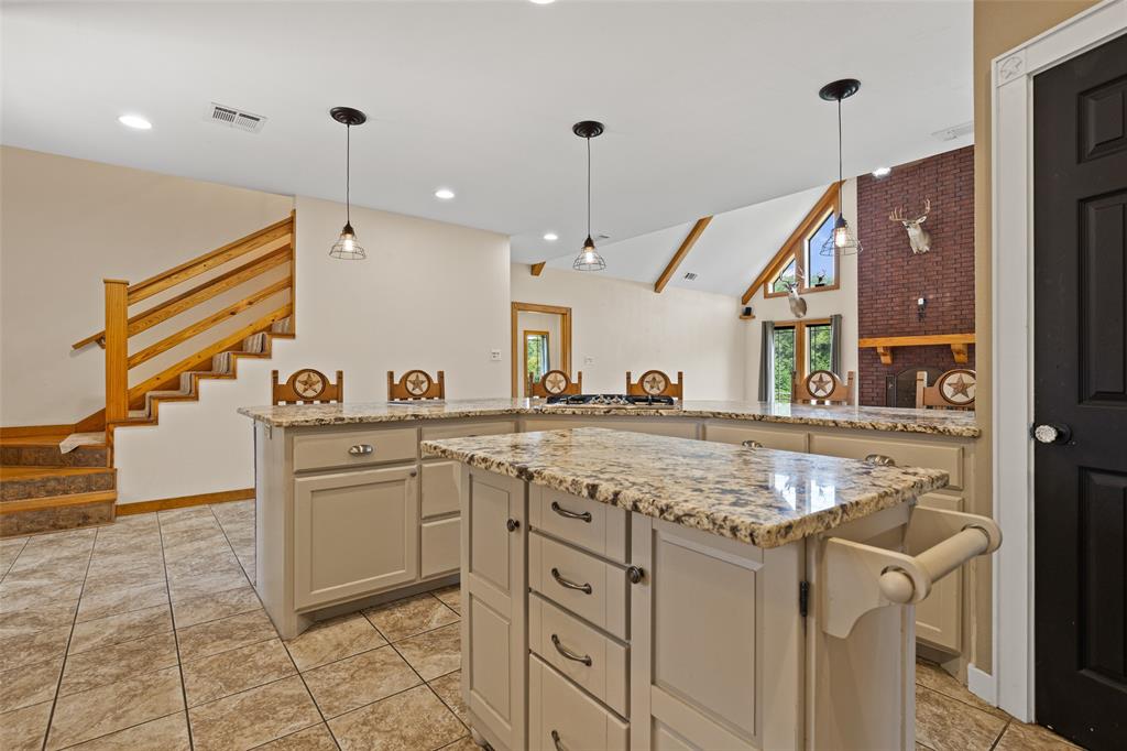 1321 North Fm 1970 Timpson, TX 75975 - Photo 7 of 29 a kitchen with stainless steel appliances granite countertop a sink and a stove