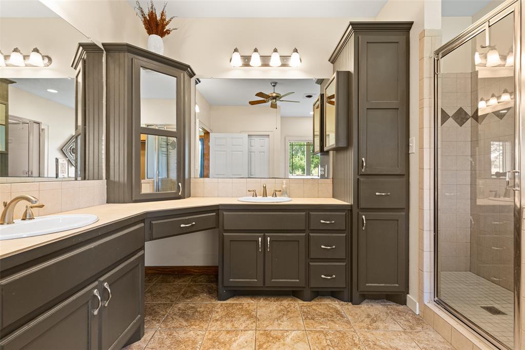 1321 North Fm 1970 Timpson, TX 75975 - Photo 9 of 29 a spacious bathroom with a bathtub sink and mirror