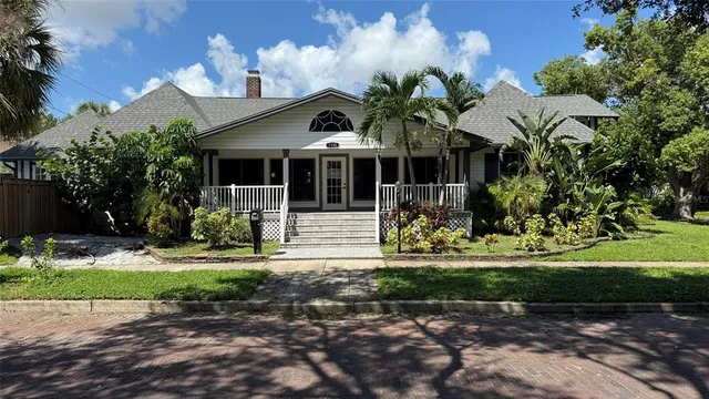 a view of a house with a yard and plants