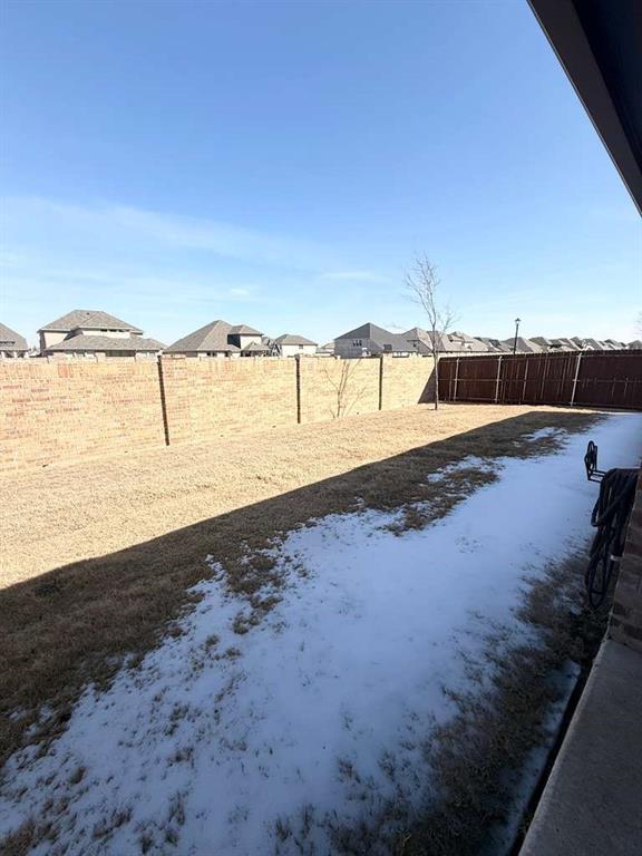 804 Marigold Street Princeton, TX 75407 - Photo 17 of 19 Fenced backyard with a residential view