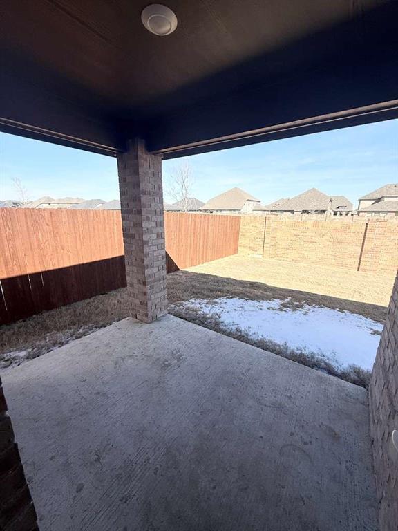804 Marigold Street Princeton, TX 75407 - Photo 18 of 19 Fenced backyard featuring a patio area and a residential view