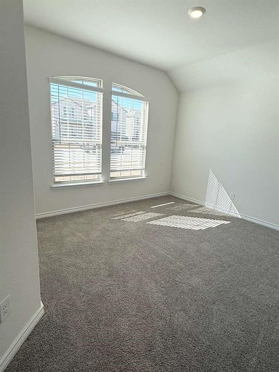 804 Marigold Street Princeton, TX 75407 - Photo 3 of 19 Carpeted spare room with vaulted ceiling and recessed lighting
