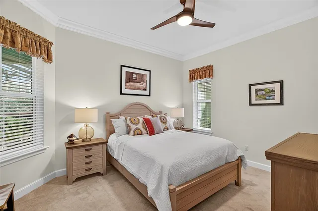 a bedroom with a bed and a night stand