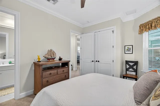 a bedroom with a bed and a television