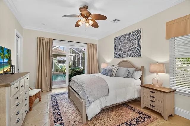 a bedroom with a bed and wooden floors