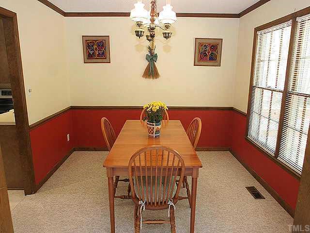 7437 Deer Track Drive Raleigh, NC 27613 - Photo 5 of 9 a view of a dining room with furniture and a window