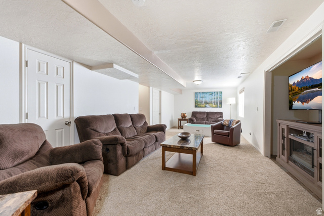 5196 Rodeo Circle Oakley, UT 84055 - Photo 33 of 57 Spacious lower-level area with neutral carpeting, white walls, and recessed lighting