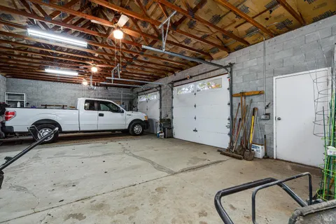 a view of parking garage with cars