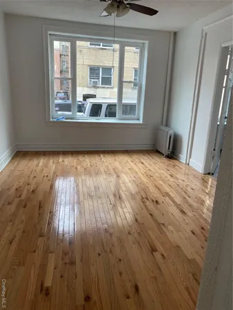 a view of hallway with wooden floor
