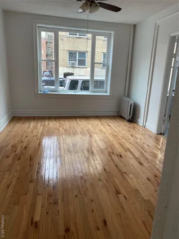 a view of hallway with wooden floor