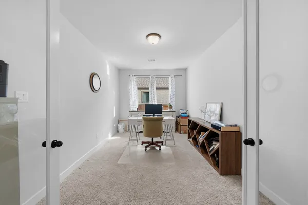 a workspace with furniture and a window