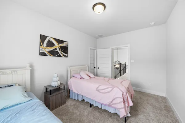 a bathroom with a double vanity sink mirror and toilet